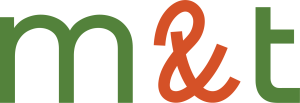 Logo featuring green lowercase letters m n and t with a large orange ampersand between them on a black background (brand mark).